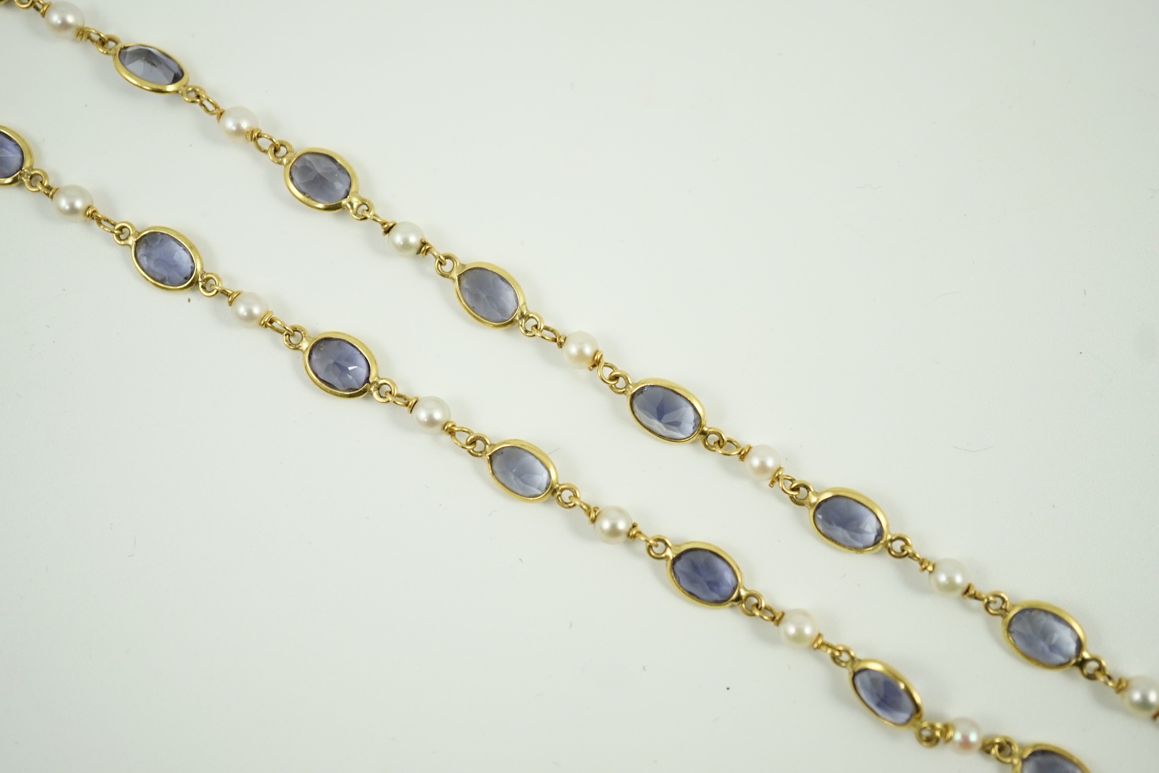 A modern 18ct gold, blue quartz and cultured pearl set spectacle necklace, 58cm, gross weight 15 grams.